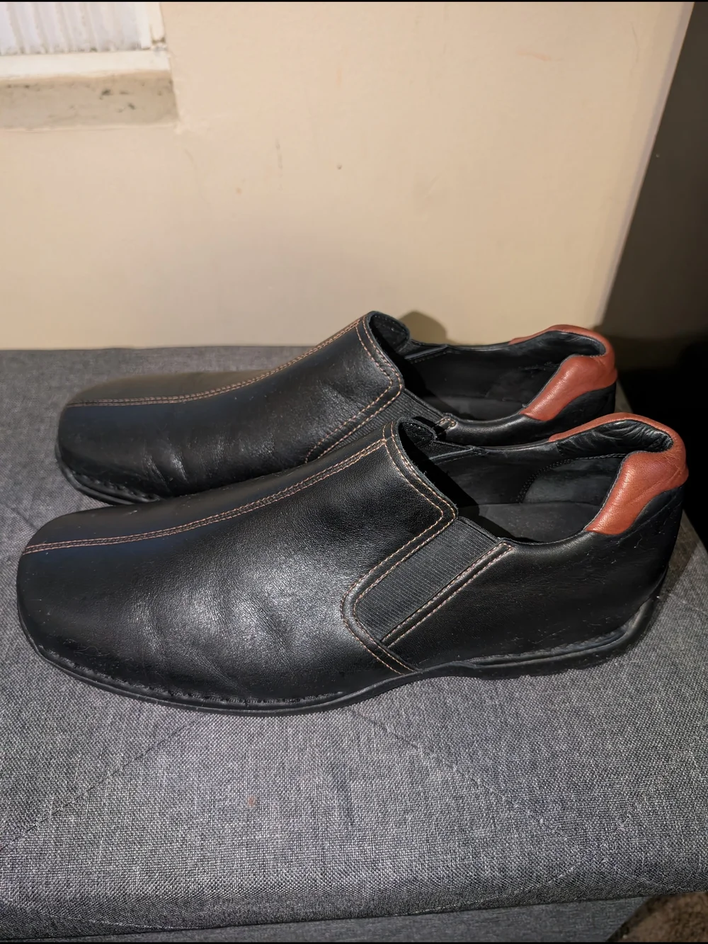 Cole Haan Black Leather Slip-On Loafers with Brown Heel Accent